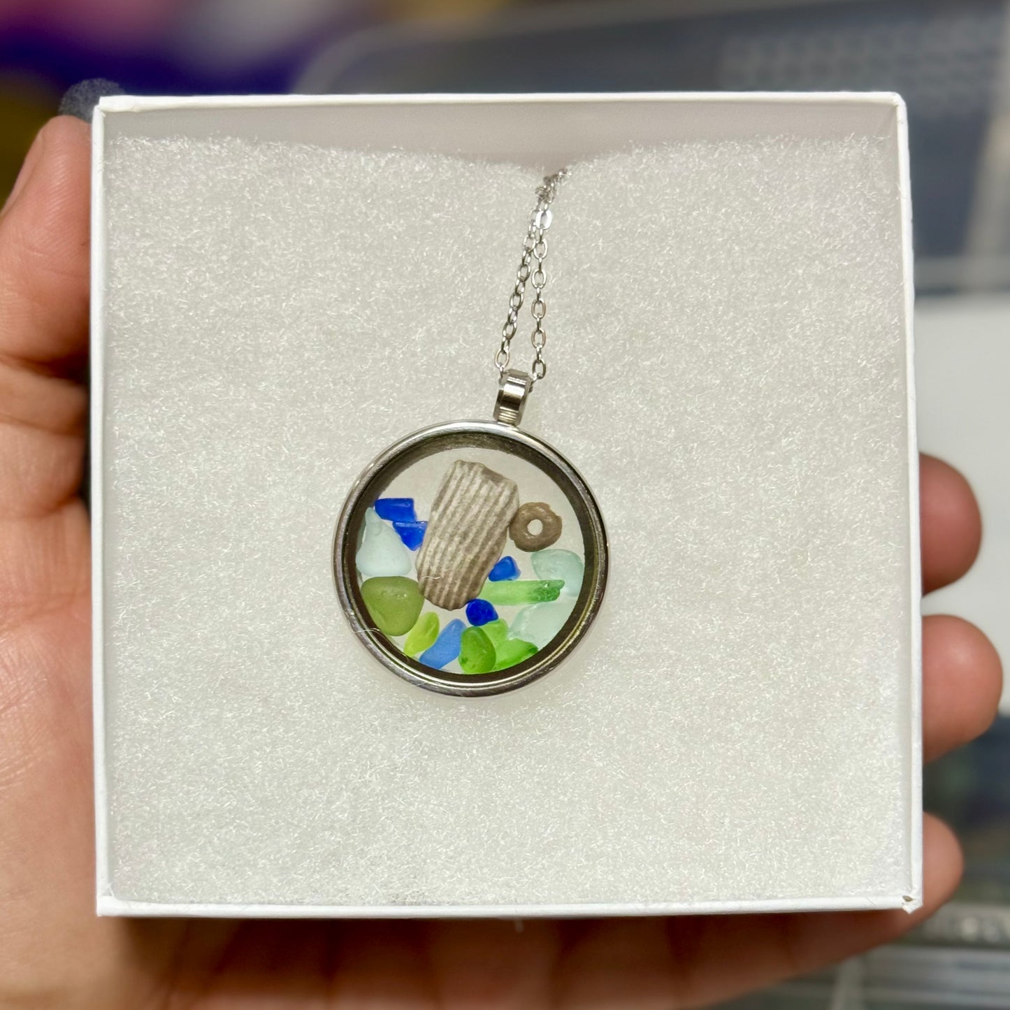 Kaleidoscope Floating Locket (Stainless Steel) - Beach Glass with Crinoid and Horn Coral Fossils